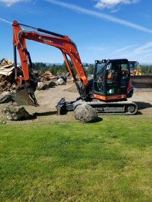 One of our newer mini-excavators for doing minor land clearing and retaining wall details.