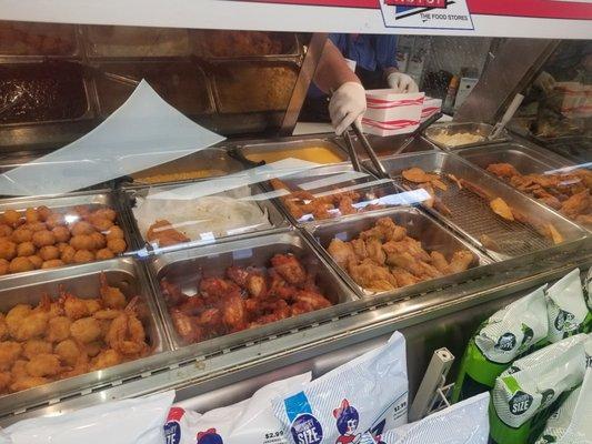 An assortment of fried goodies.  Greens and mashed potatoes/gravy too.