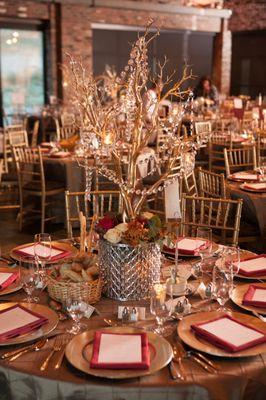 The slate floors and brick interior provide a stunning backdrop for an elegant reception.