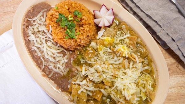 Green chilaquiles served with rice and beans