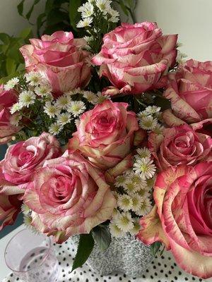 Pink roses and small white flowers