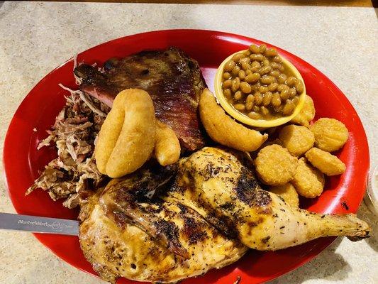 Ribs, chicken, chopped pork, baked beans, corn nuggets, and baked beans.