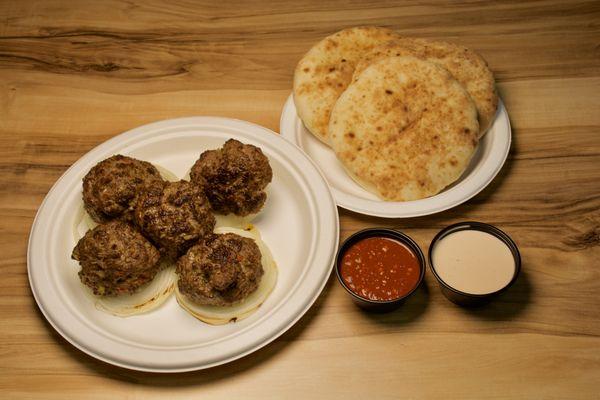 Arab Meatball: flavorful dish made with ground meat, usually lamb or beef, combined with aromatic spices like cumin, coriander, and garlic.