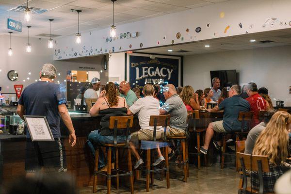 Main taproom. Multiple types of seating options throughout including high-top / bar seating, low seating and lounge seating.