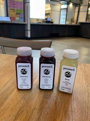 Pressed juice shots $4 each. The elderberry was the easiest to drink, recovery was tart, and reset packs a punch from the apple vinegar