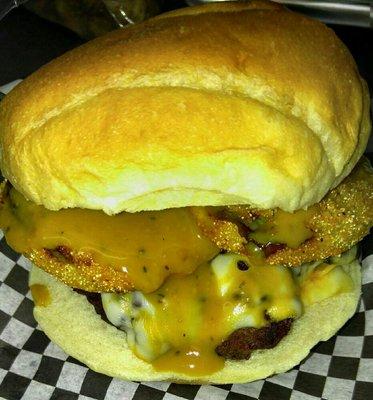 The Carolina Burger with fried green tomatoes Colby Jack cheese bacon and Carolina barbecue sauce