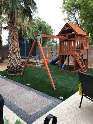 Pavers, artificial turf and playground