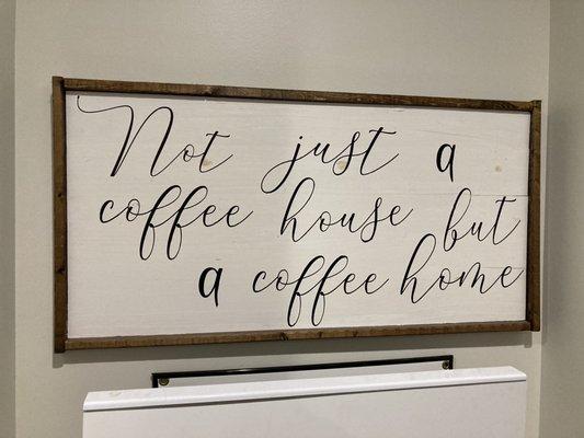 "Not just a coffee house, but a coffee home" sign.