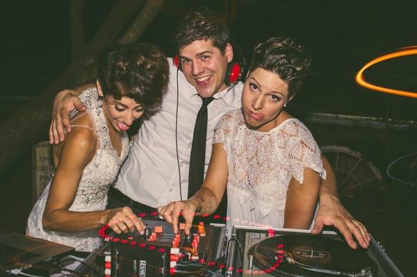 What a good guy....even lets the brides behind the turntables!