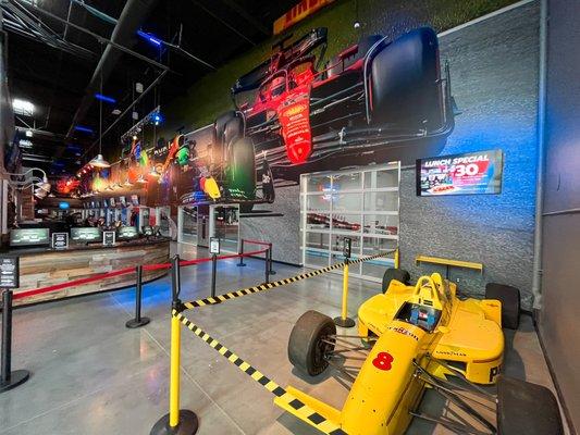 An authentic 90s IndyCar sits on display in  K1 Speed's lobby.