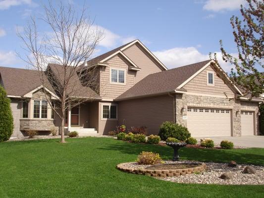 Vinyl siding with cultured stone