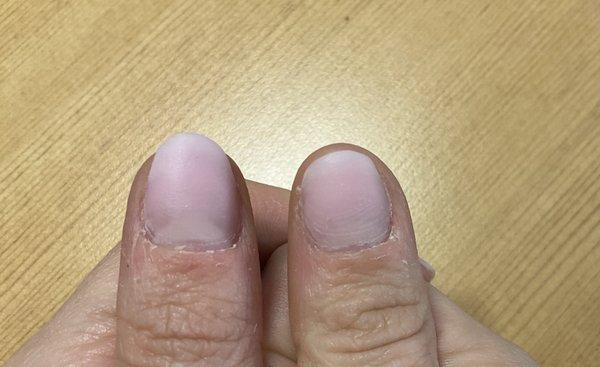 completely uneven and every nail has a different shape. she just rushed through it.