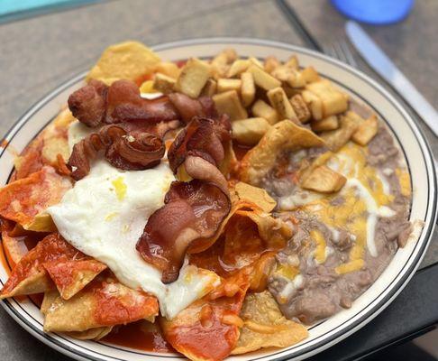 Chilaquiles rojo. Topped w/ egg and bacon. Delicious, but chips got soggy fast :(