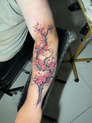 Vibrant cherry blossoms tree tattoo