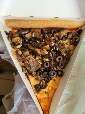 Pizza with uncooked mushrooms + olives, uncooked, just dumped onto pizza bread not even melted into it.