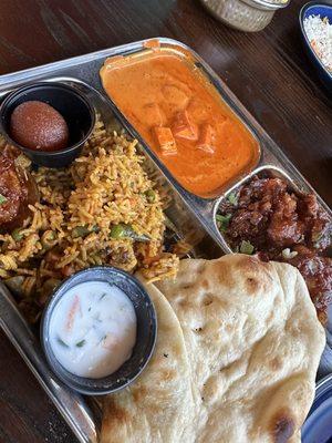 Veg lunch box with paneer, biriyani, and gobi manchurian