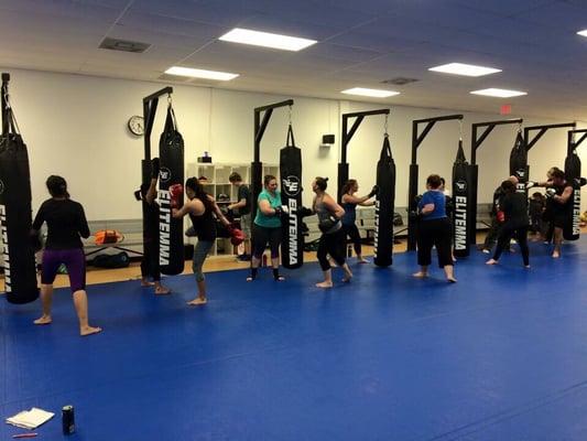 Kickboxers learning self defense as they are burning tons of calories.