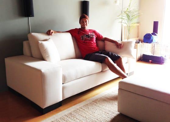 Photo of hubby, happy to be my model on his new sofa.