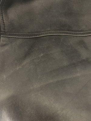 Overconditioned leather, the white patches is conditioner still remaining on the jacket.