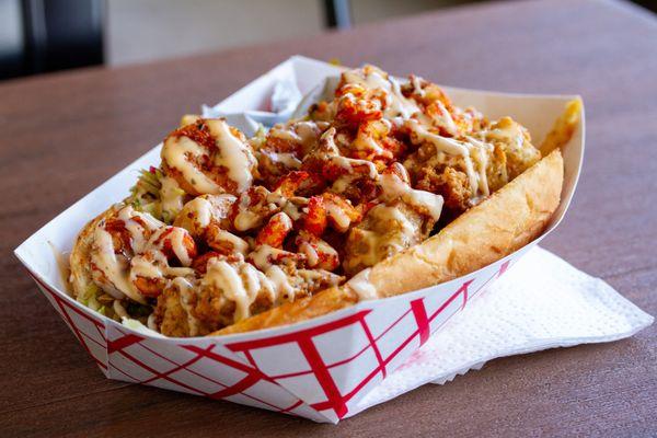 Bayou Classic (grilled shrimp, crawfish, and crispy gator on a french roll with housemade remoulade and pickled slaw) - $20