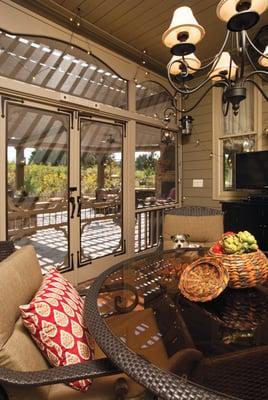 Interior of screened porch with our little friend, Bella.