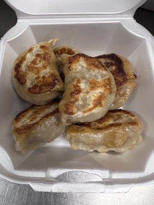 Gently steamed pork dumplings then fried crispy over a grill.