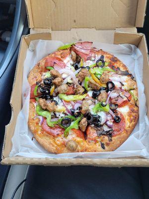 Deluxe Pizza (sausage, Canadian bacon, pepperoni, red onions, green peppers, black olives, mushrooms.