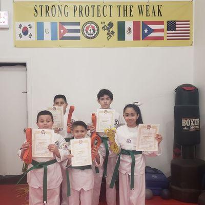 Students receiving their new belts