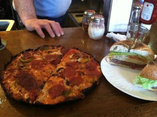 Pepperoni, hot pepper, and onion pizza and a burger with Swiss l/t/o