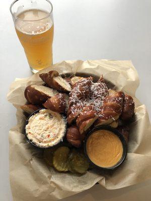 Scooter blood orange radler with pretzels and beer cheese and pimento cheese