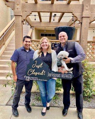 Our realtor Jose Velasquez on the left, myself and my husband. And of course our dog.