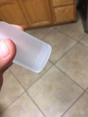 White sticky film inside dropper.