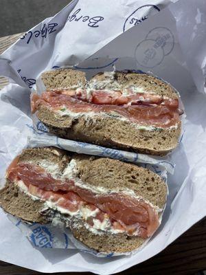 Whole wheat everything bagel with tomato, onion lox and cream cheese