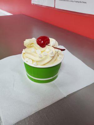 Delicious non-fat Vanilla and a little low-fat Cake Batter froyo, topped with yogurt drops and a single Maraschino cherry!