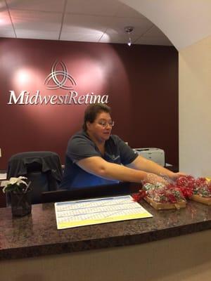 Receptionist, Maggie at Midwest Retina (downtown office) receives her Christmas gift. These people are so wonderful.