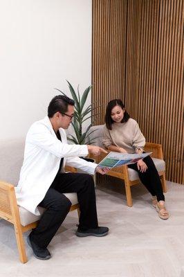 Family Dentist Dr. Isaac Sun Providing Consultation for Patient