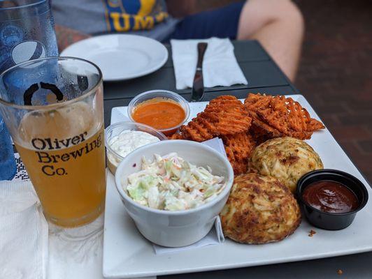 Crab cake dinner with sweet potato fries and Cole slaw. Ice cold BMore Hazy on draft.