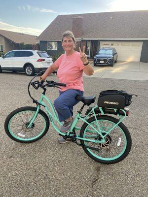 Tracey with her new bike.     After riding almost a dozen bike brands we finally went with the Pedego interceptor.    This bike has it all.