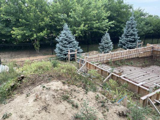 Under all those weeds is the garbage they left behind to include lots of cigarette butts, beer bottles, and pieces of rebar and wood.