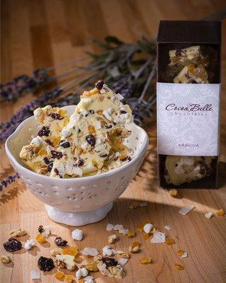 Ambrosia Chocolate Bark: white chocolate with coconut, dried cherries, candied citrus, candied pineapple, marshmallows and walnuts