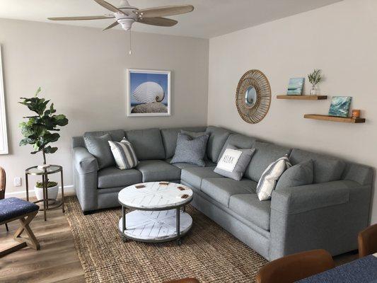 Beach house remodel showing sleeper sectional from Coastal Furniture.