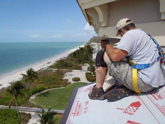 5 stories up in the blistering sun, so close to the water yet so far. A bat exclusion in Naples FL