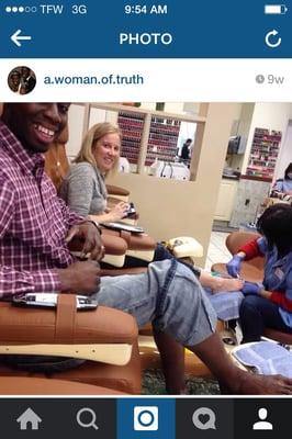 Hubby enjoying his pedicure. The woman next to him tried to get her husband to do it but no avail.