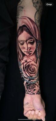 Rose tattoo with the Virgin Mary