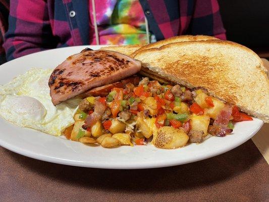 Eggs, ham, toast and loaded potatoes