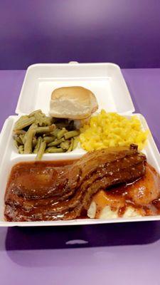 Sliced roast beef and gravy plate