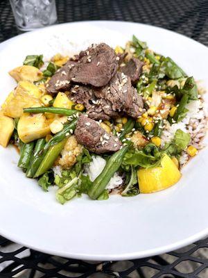 Coconut rice bowl with steak and assorted veggies. Very flavorful and steak was tender.