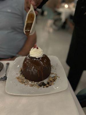 This is called a balloon cake, they pour hot chocolate over until it melts into the cake inside.