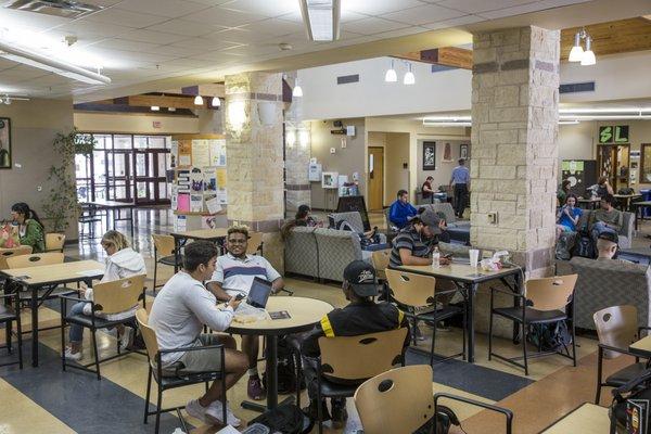 Students taking a break and relaxing in the Student Commons area