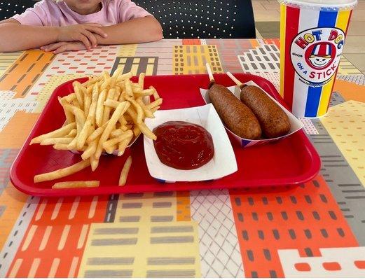 Fries, beef corn dog on left, American cheese corn dog, regular lemonade.